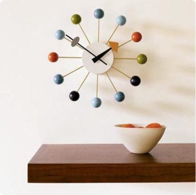 The George Nelson ball Clock is an exact replica of the original 1948 design. It is available in red, orange, multi-coloured, natural spruce and black with brass. 