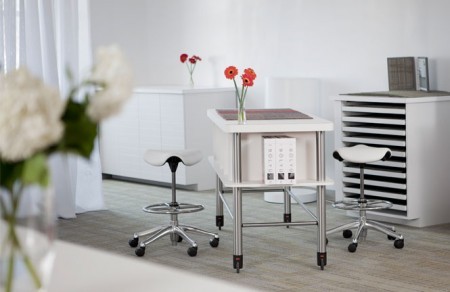 The triangular cushion of the Saddle and Pony Saddle encourages users to sit in a  "saddle" posture. Sitting in this position lowers the thighs, opens up the hips and allows for increased circulation. This stool is available in a variety of fabrics and also leather.